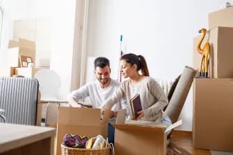 Image showing someone moving boxes to signify why and how to sell house cash fast ontario